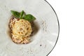 Spaghetti with ham and cheese in a plate. A mouth-watering tradi