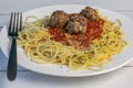 home made meat balls resting on spaghetti Royalty Free Stock Photo