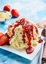 Spaghetti ice cream with strawberry topping Royalty Free Stock Photo