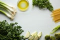 Spaghetti ingredients: green vegetables, olive oil, parsley, onion, broccoli, zucchini, paprika Royalty Free Stock Photo