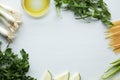 Spaghetti ingredients: green vegetables, olive oil, parsley, onion, broccoli, zucchini, paprika Royalty Free Stock Photo