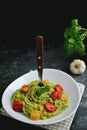 Spaghetti italian pasta with avocado sauce and cherry tomatoes Royalty Free Stock Photo