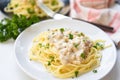 Spaghetti italian pasta served on white plate with parsley in the restaurant italian food and menu concept - spaghetti carbonara Royalty Free Stock Photo