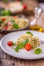 Spaghetti. Italian pasta spaghetti with basil pesto cherry tomatoes and olive oil Royalty Free Stock Photo