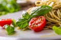 Spaghetti. Italian pasta spaghetti with basil pesto cherry tomatoes and olive oil Royalty Free Stock Photo