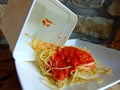 Spaghetti leftovers from a plastic container