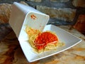 Spaghetti leftovers from a plastic container Royalty Free Stock Photo