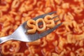 Spaghetti letter spelling the word SOS standing for Save Our Souls, with the letters held up on a fork.