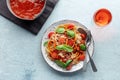 Spaghetti marinara, pasta with tomato sauce and basil, overhead shot Royalty Free Stock Photo