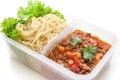 Spaghetti meat sauce ready to eat in lunch box, on white background isolated Royalty Free Stock Photo