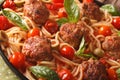 Spaghetti with meatballs, olives and tomato sauce macro. horizon Royalty Free Stock Photo