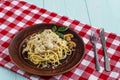 Spaghetti with mushrooms in cream sauce on a blue wooden background. Royalty Free Stock Photo