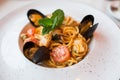 Spaghetti with mussels seafood. Soba noodles with shrimps and vegetables. Asian food. Pasta with seafood in tomato sauce.