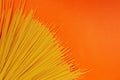 Spaghetti on an orange background Royalty Free Stock Photo