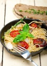 Spaghetti pasta with baked cherry tomatoes and basil Royalty Free Stock Photo