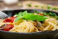 Spaghetti pasta with baked cherry tomatoes and basil Royalty Free Stock Photo