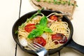 Spaghetti pasta with baked cherry tomatoes and basil Royalty Free Stock Photo