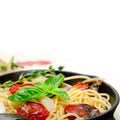 Spaghetti pasta with baked cherry tomatoes and basil Royalty Free Stock Photo