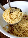 Spaghetti pasta twisted in ladle