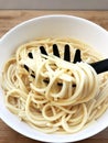 Spaghetti pasta in a dish isolated on white background Royalty Free Stock Photo