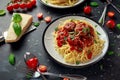 Spaghetti pasta meatballs with tomato sauce, basil, herbs parmesan cheese on dark background Royalty Free Stock Photo