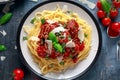 Spaghetti pasta meatballs with tomato sauce, basil, herbs parmesan cheese on dark background Royalty Free Stock Photo