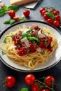 Spaghetti pasta meatballs with tomato sauce, basil, herbs parmesan cheese on dark background Royalty Free Stock Photo