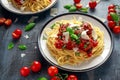 Spaghetti pasta meatballs with tomato sauce, basil, herbs parmesan cheese on dark background Royalty Free Stock Photo