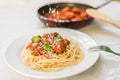 Spaghetti pasta with meatballs in tomato sauce, cheese falling over it Royalty Free Stock Photo