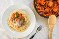 Spaghetti pasta with meatballs in tomato sauce, cheese falling over it Royalty Free Stock Photo