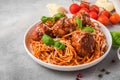 Spaghetti pasta with meatballs, tomato sauce, parmesan cheese and basil. italian food. close up