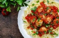 Spaghetti pasta with meatballs in tomato sauce with parsley in plate, rustic wooden table background, top view, close-up Royalty Free Stock Photo