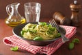 Spaghetti pasta with pesto sauce over rustic table Royalty Free Stock Photo