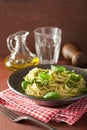 Spaghetti pasta with pesto sauce over rustic table Royalty Free Stock Photo