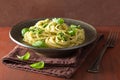 Spaghetti pasta with pesto sauce over rustic table Royalty Free Stock Photo