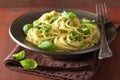 Spaghetti pasta with pesto sauce over rustic table Royalty Free Stock Photo