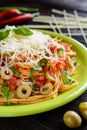 Spaghetti pasta salad with tomato sauce, olives, Gouda cheese and basil Royalty Free Stock Photo