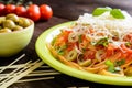 Spaghetti pasta salad with tomato sauce, olives, Gouda cheese and basil Royalty Free Stock Photo