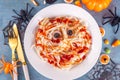 Spaghetti pasta with sausages mummies