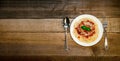 Spaghetti Pasta with Tomato Sauce, Cheese and Basil on Wooden Table. Traditional Italian Food. Royalty Free Stock Photo