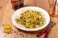 Spaghetti Pesto with shrimps and zucchini served on wooden table, side view Royalty Free Stock Photo