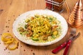 Spaghetti Pesto with shrimps and zucchini served on wooden table, side view Royalty Free Stock Photo