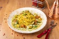 Spaghetti Pesto with shrimps and zucchini served on wooden table, side view Royalty Free Stock Photo