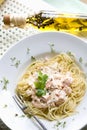 Spaghetti with salmon, mornay sauce and cress on plate, elevated view Royalty Free Stock Photo