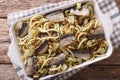 Spaghetti with sardines, fennel, raisins, nuts and parsley close Royalty Free Stock Photo