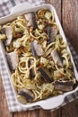 Spaghetti with sardines, fennel, raisins, nuts and parsley close Royalty Free Stock Photo