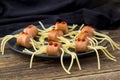 spaghetti with sausages in the form of spiders. Happy kid food for Halloween party