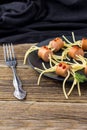 spaghetti with sausages in the form of spiders. Happy kid food for Halloween party Royalty Free Stock Photo