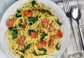 spaghetti with sauteed spinach and tomatoes Royalty Free Stock Photo
