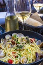 Spaghetti with sea clams, pasta vongole served in cooking pan, tasty italian seafood Royalty Free Stock Photo